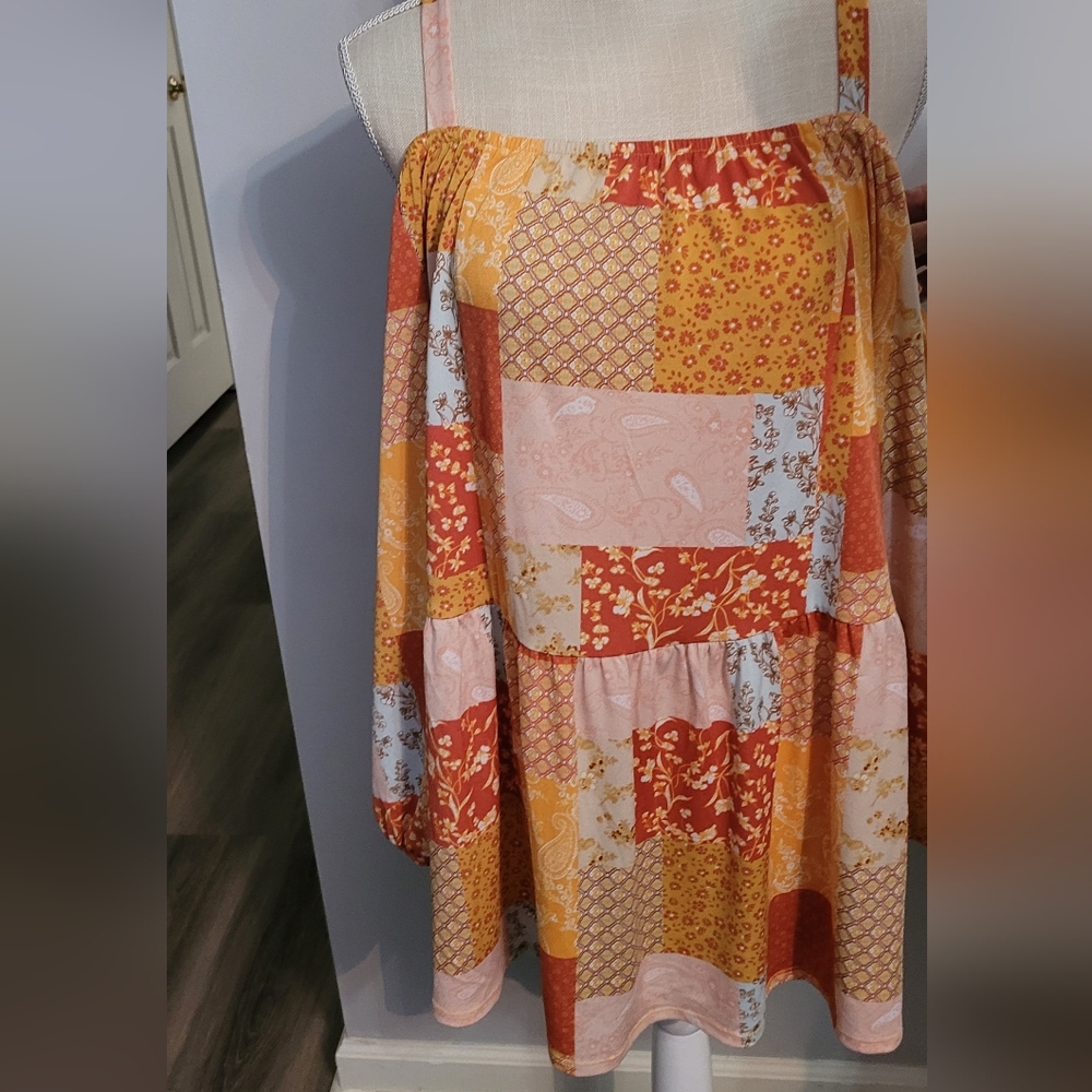 Cato off shoulder or cold shoulder with straps.